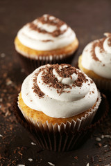 Delicious cupcakes on table close-up