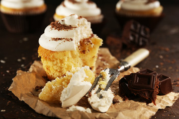 Delicious cupcakes on table close-up