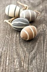 ceramic easter eggs on rustic wooden background