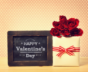 Happy Valentines Day message with roses and present box