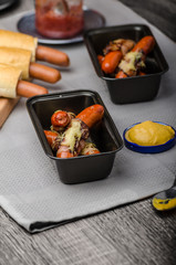 Fried sausage in a robe of bacon and cheese