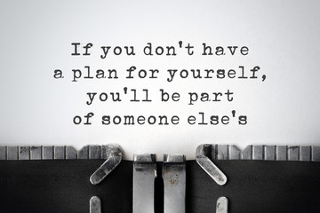 Practicality. Inspirational quote typed on an old typewriter. © Zerophoto