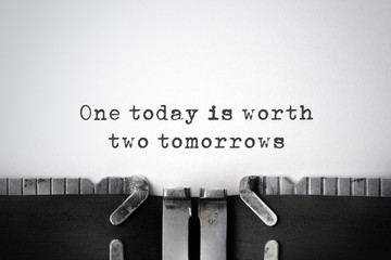 Practicality. Inspirational quote typed on an old typewriter.