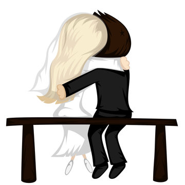 Lovely newlywed couple sit on a bench hugging.