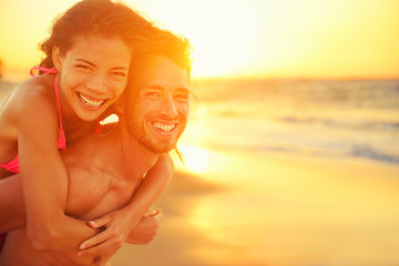 Lovers couple in love having fun on beach portrait