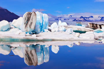 Icebergs  are reflected in water