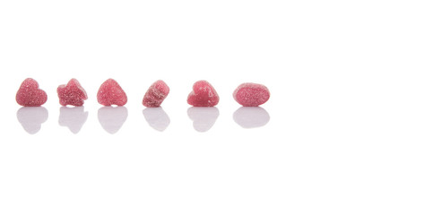 Purple colored sugar jelly candy over white background