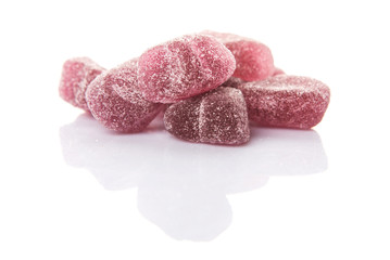 Purple colored sugar jelly candy over white background
