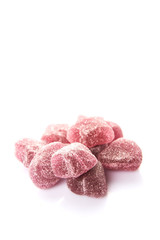 Purple colored sugar jelly candy over white background