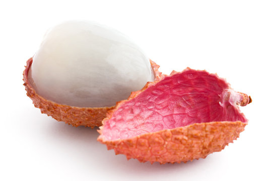 Single litchi with skin removed and flesh. On white.