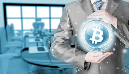 Businessman with protective gesture bitcoins