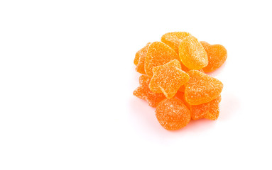 Orange colored sugar jelly candy over white background