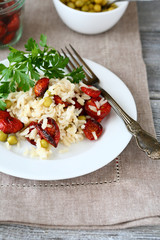 Rice with sun-dried tomatoes in a plate