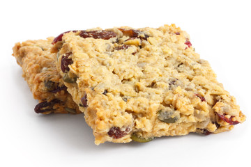 Homemade luxury fruit muesli bar. On white.