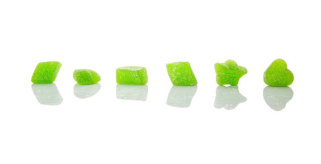 Green colored sugar jelly candy over white background