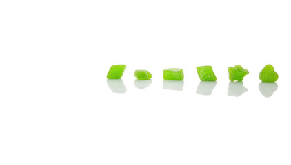 Green colored sugar jelly candy over white background