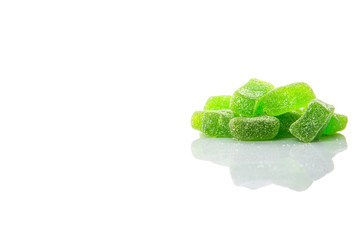 Green colored sugar jelly candy over white background