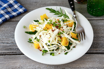 Easy coleslaw greens and oranges on a plate