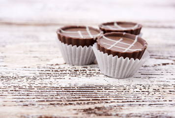 Dark chocolate on wooden background