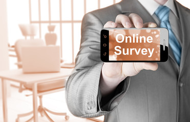 Businessman showing business concept on smartphone  - Online