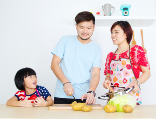 Asian family cooking in the kitchen