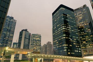City night scene with business office skyscrapers in Hong Kong,
