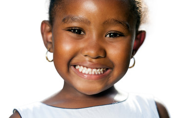 Extreme close up of small african girl showing teeth.T
