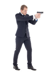 special agent man in business suit posing with gun isolated on w