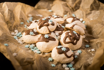 Freshly baked meringues on baking paper