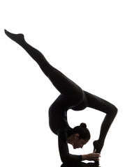 woman exercising gymnastic yoga  Eka Pada Viparita Dandasana sil
