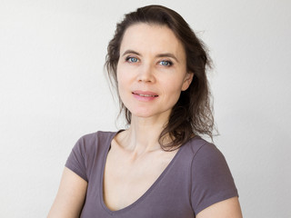 Fototapeta premium Woman with attractive smile looking into camera