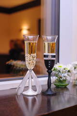two glasses with champagne wedding style bride and groom