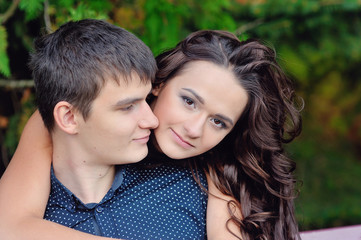 Fototapeta premium young couple in love woman hugging man, close-up, valentine's da