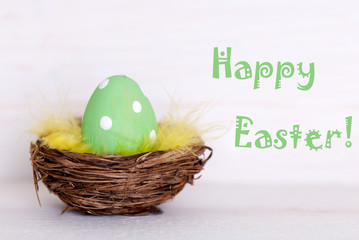 One Green Easter Egg In Nest With Happy Easter