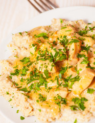 chicken breast with sauce and oatmeal
