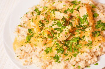 chicken breast with sauce and oatmeal