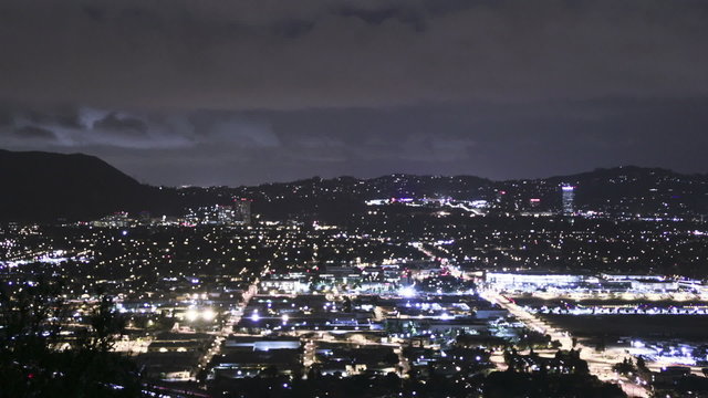 Slow tilt time lapse shot revealing moving city at night