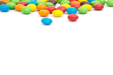 A colorful assortment of shiny round gumballs.