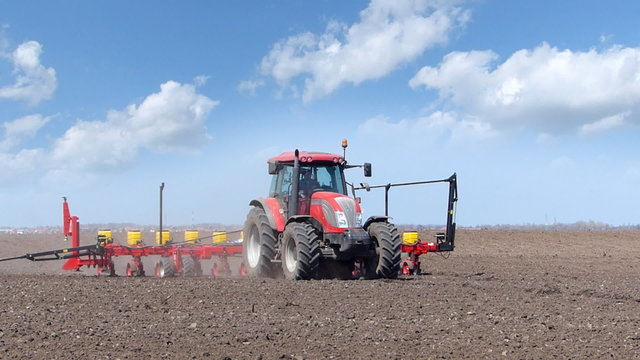 Tractor seeding on a field