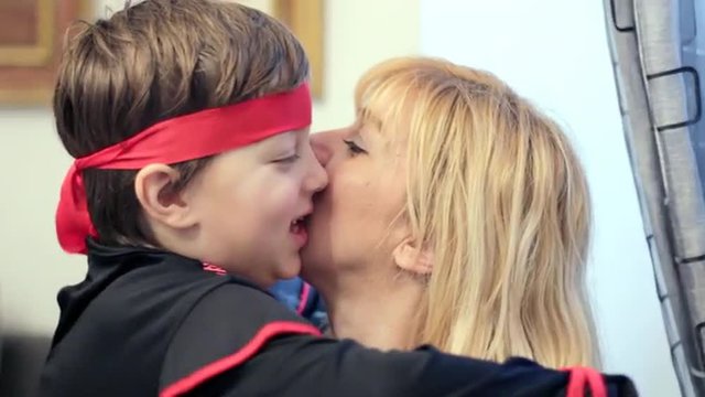 mother and son in costume,hugs and kisses