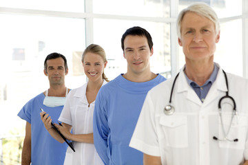 hospital medical people standing in a row with leadership of senior doctor