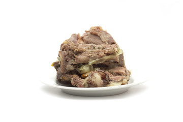 Bone with meat on a plate. Photo.