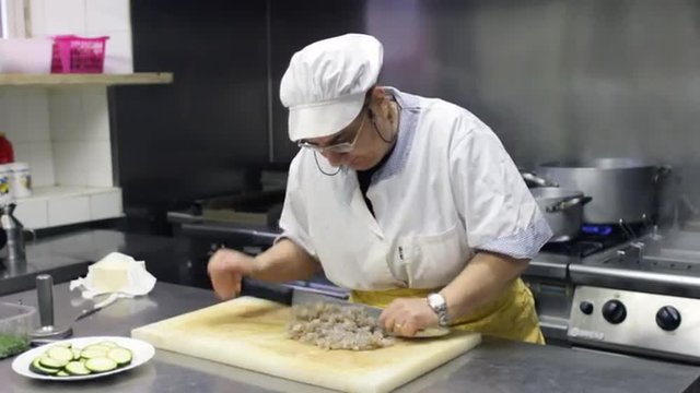 chef cutting scampi
