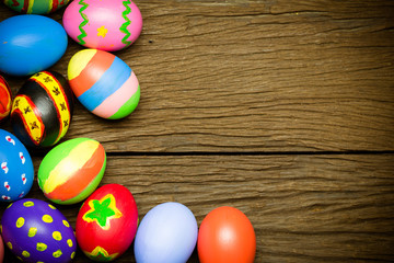Fototapeta na wymiar Easter eggs on wood background