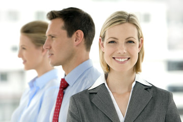 Young business team standing in a row with selective focus