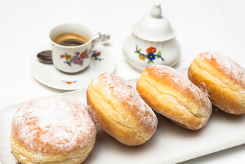 Krapfen and hot coffee