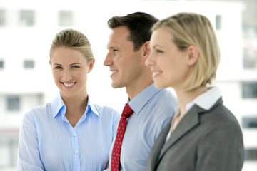 Young business team standing in a row with selective focus