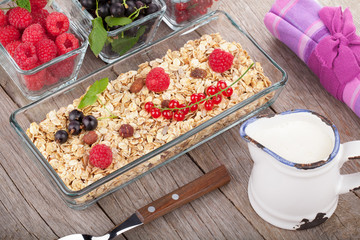 Healthy breakfast with muesli, milk and berries