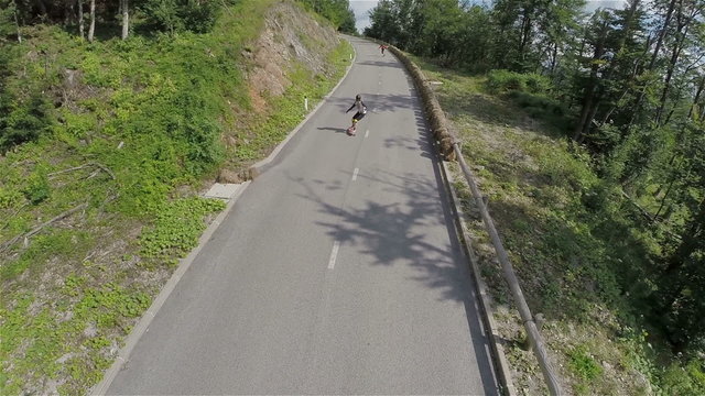 Over head aerial footage of longboard skaters