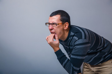 male of European appearance causes vomiting putting his fingers